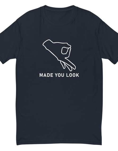 Load image into Gallery viewer, Navy Blue t-shirt that shows a drawn hand with the thumb and index finger forming  a circle and a caption of made you look.
