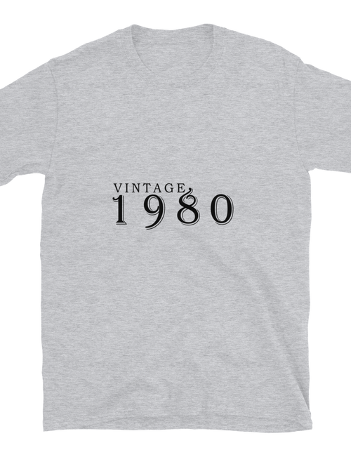Load image into Gallery viewer, Gray Tshirt, front view, with the text of &quot;Vintage 1980&quot; typed on it.

